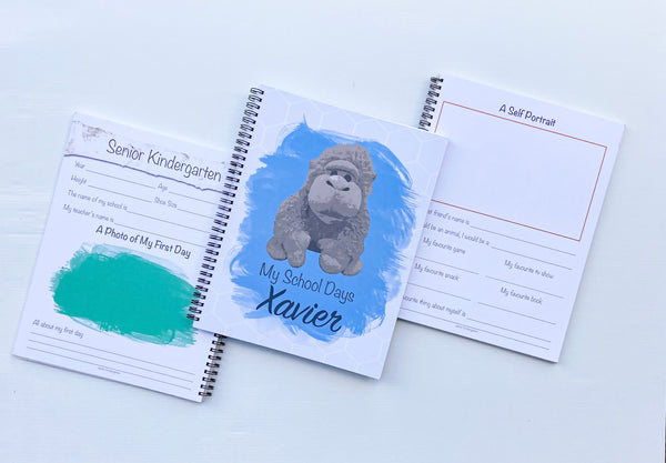 Three personalized school journals sitting side by side