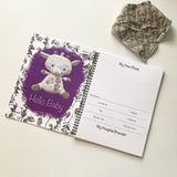 purple baby book with giraffe - hello baby section