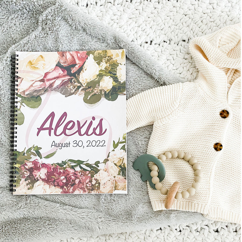 book baby - roses, lying on crib alongside newborn sweater